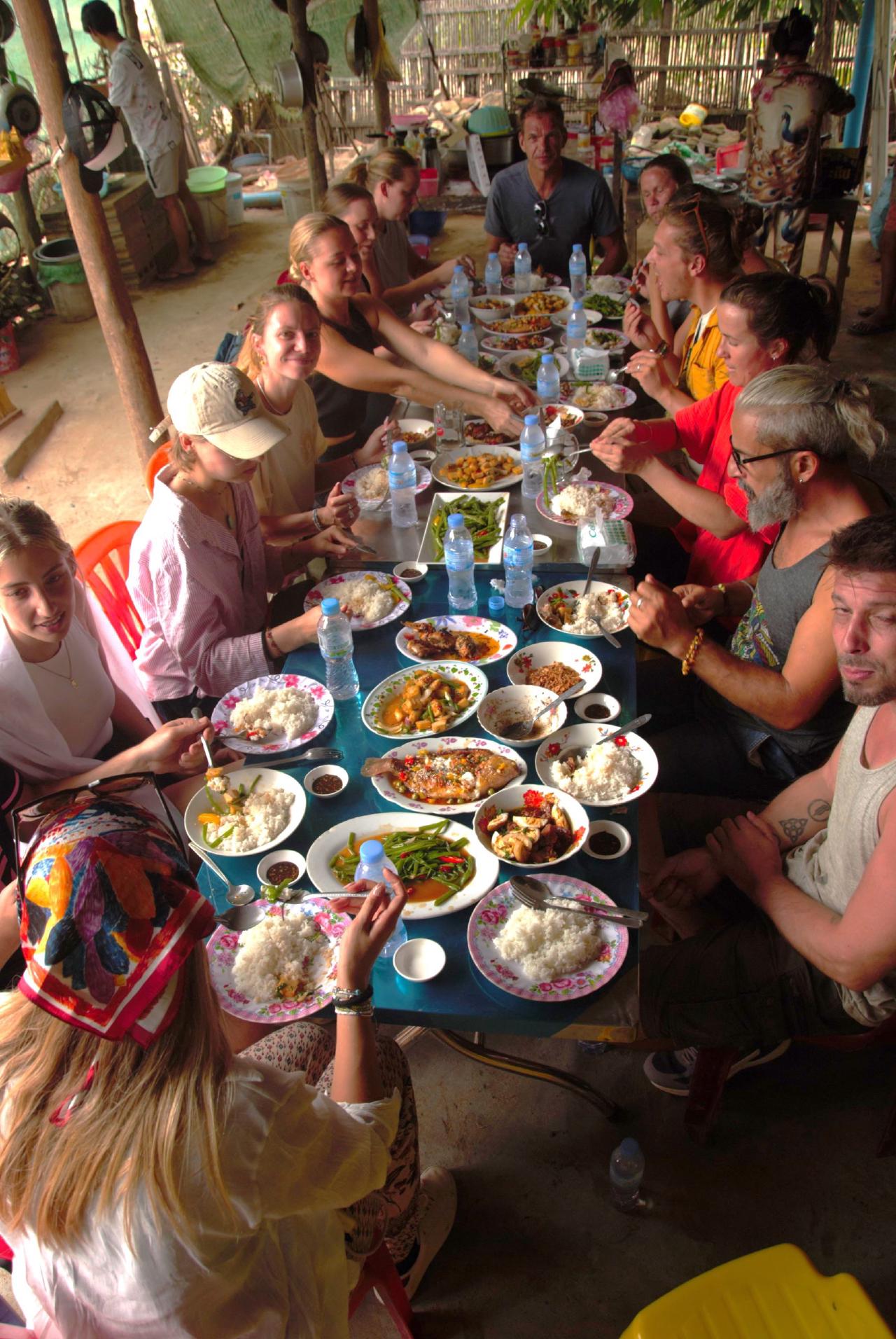 Vin serving lunch to guests inside her 120-year-old wooden home